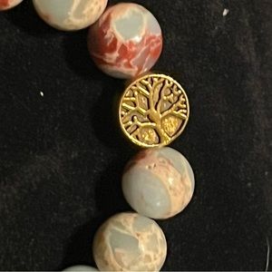 Hand beaded snakeskin Jasper bracelet with copper tree of life charm